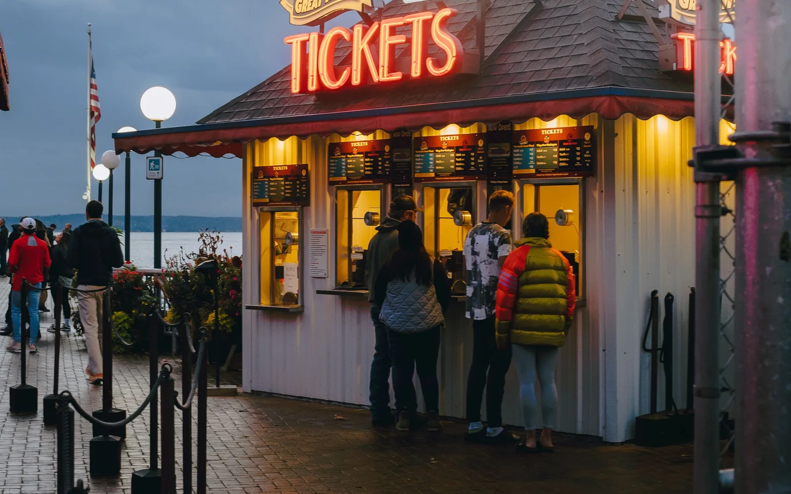 Visitors standing outside an attraction ticket booth